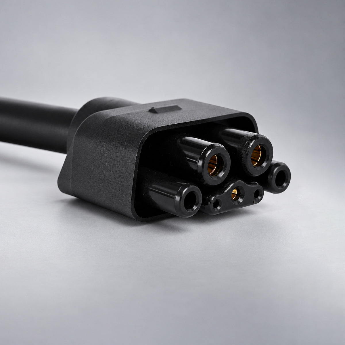 Close-up of the WenStorm adapter connector designed for compatibility with both Tesla Gen 2 and Gen 3 Mobile Connectors.